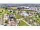 A beautiful aerial view of the community pool and playground for neighborhood residents to enjoy on hot summer days at 22977 E Desert Spoon Dr, Queen Creek, AZ 85142