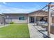 Well-kept backyard with artificial turf, a pergola, and an inviting space for outdoor relaxation at 22977 E Desert Spoon Dr, Queen Creek, AZ 85142