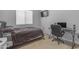 Cozy bedroom with a work space and large window with blinds at 22977 E Desert Spoon Dr, Queen Creek, AZ 85142