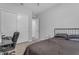 Bedroom featuring modern closet doors and a comfortable work space at 22977 E Desert Spoon Dr, Queen Creek, AZ 85142