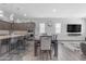 Open-concept dining area with views of the kitchen and living space, ideal for entertaining guests at 22977 E Desert Spoon Dr, Queen Creek, AZ 85142