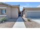 Inviting home exterior featuring a walkway leading to the front door with welcoming decor at 22977 E Desert Spoon Dr, Queen Creek, AZ 85142