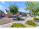 Attractive single-story house featuring low-maintenance landscaping and a two-car garage at 22977 E Desert Spoon Dr, Queen Creek, AZ 85142