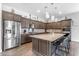 Spacious kitchen with granite island, stainless steel appliances, and ample cabinet space at 22977 E Desert Spoon Dr, Queen Creek, AZ 85142