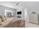 Comfortable main bedroom with ample space, modern decor, and an ensuite bathroom at 22977 E Desert Spoon Dr, Queen Creek, AZ 85142