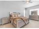 Stylish main bedroom featuring decorative pillows, side tables, and lots of natural light at 22977 E Desert Spoon Dr, Queen Creek, AZ 85142