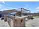 Backyard showcasing a built-in outdoor grill, pergola, and comfortable seating for entertaining at 22977 E Desert Spoon Dr, Queen Creek, AZ 85142