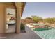 Relaxing backyard oasis with a stone spa and pool, visible from the home's bedroom at 24042 N 170Th Ln, Surprise, AZ 85387