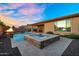 Backyard featuring a pool, spa, outdoor seating and barbecue area at 24042 N 170Th Ln, Surprise, AZ 85387