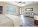 A bright bedroom with a sliding glass door to the backyard pool and an additional sitting area at 24042 N 170Th Ln, Surprise, AZ 85387
