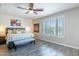 Serene bedroom with plantation shutters, a ceiling fan, and a comfortable bed with decorative pillows at 24042 N 170Th Ln, Surprise, AZ 85387