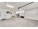 Large garage with well-lit open space and storage, perfect for hobbies at 24042 N 170Th Ln, Surprise, AZ 85387