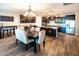 Bright open kitchen featuring dark cabinetry, stainless steel appliances, and a large granite island at 24042 N 170Th Ln, Surprise, AZ 85387