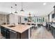 This kitchen boasts granite countertops, stainless steel appliances and a seating bar at 24042 N 170Th Ln, Surprise, AZ 85387