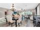 An open-concept dining and living room area with elegant furnishings and natural lighting at 24042 N 170Th Ln, Surprise, AZ 85387