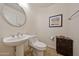 Clean bathroom with modern sink, toilet, and decorative furnishings at 2425 W Woburn Ln, Phoenix, AZ 85085