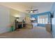 Bedroom featuring a bunk bed, carpet, window with shutters, ceiling fan, and a desk area at 2425 W Woburn Ln, Phoenix, AZ 85085