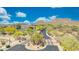 Gated community entrance with well-manicured landscaping and mountain views, offering security and curb appeal at 2425 W Woburn Ln, Phoenix, AZ 85085