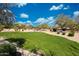Community park featuring lush green grass, shade trees, and walking paths for outdoor enjoyment and recreation at 2425 W Woburn Ln, Phoenix, AZ 85085