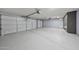 Spacious three car garage with epoxy floor, storage and ample room for parking at 2425 W Woburn Ln, Phoenix, AZ 85085