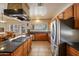Kitchen with granite counters, stainless steel appliances, island and plenty of cabinet space at 2425 W Woburn Ln, Phoenix, AZ 85085