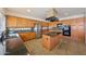 Kitchen featuring granite countertops, stainless appliances, and an island cooktop at 2425 W Woburn Ln, Phoenix, AZ 85085