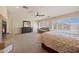 Bright primary bedroom boasts a fireplace, sitting area and lots of natural light at 2425 W Woburn Ln, Phoenix, AZ 85085