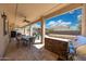 Outdoor kitchen with stainless steel grill and bar seating, perfect for entertaining by the pool at 2425 W Woburn Ln, Phoenix, AZ 85085