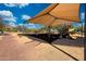Shaded playground area with swings, slides, and play equipment, offering a fun and safe environment for children at 2425 W Woburn Ln, Phoenix, AZ 85085