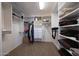Well-organized walk-in closet with custom shelving and ample storage space at 2425 W Woburn Ln, Phoenix, AZ 85085