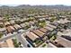 Expansive aerial view of a neighborhood with mountain views in the distance at 2768 W Jasper Butte Dr, San Tan Valley, AZ 85144