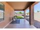 Relaxing covered back patio with a seating area and artificial turf at 2768 W Jasper Butte Dr, San Tan Valley, AZ 85144