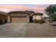 Charming single-Gathering home with a two-car garage, desert landscaping, and a welcoming entrance at 2768 W Jasper Butte Dr, San Tan Valley, AZ 85144