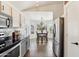 Modern kitchen and breakfast nook featuring stainless steel appliances and a view to the outside at 2768 W Jasper Butte Dr, San Tan Valley, AZ 85144