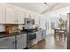 Well-lit kitchen featuring stainless steel appliances, a breakfast nook, and ample cabinet space at 2768 W Jasper Butte Dr, San Tan Valley, AZ 85144