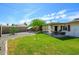Lush backyard with green lawn, covered patio, and desert landscaping, perfect for relaxation at 2901 W Mandalay Ln, Phoenix, AZ 85053