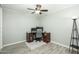 This bedroom features a ceiling fan, wood-look flooring and a desk area for work at 2901 W Mandalay Ln, Phoenix, AZ 85053