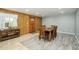Dining room with wood table, front door entrance, and decorative wall paneling at 2901 W Mandalay Ln, Phoenix, AZ 85053