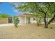 Exterior of home with covered porch and desert landscaping, including mature cactus at 2901 W Mandalay Ln, Phoenix, AZ 85053