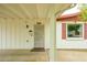 Inviting front porch with security door, exterior lighting and window with red shutters at 2901 W Mandalay Ln, Phoenix, AZ 85053