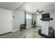 Home gym with tile floors, exercise equipment, and access to the outdoors at 2901 W Mandalay Ln, Phoenix, AZ 85053