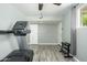 Home gym featuring a treadmill, weight rack, and plenty of space for activities at 2901 W Mandalay Ln, Phoenix, AZ 85053
