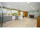 Bright, open kitchen featuring white appliances, tile floors, and an adjacent dining area at 2901 W Mandalay Ln, Phoenix, AZ 85053