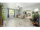 Bright living room featuring wood-look floors, natural light, and comfortable furnishings at 2901 W Mandalay Ln, Phoenix, AZ 85053