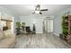 Comfortable living room featuring wood-look floors and views of the kitchen area at 2901 W Mandalay Ln, Phoenix, AZ 85053