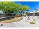 Lush backyard with mature trees, a well-kept lawn, and desert landscaping at 2935 W Kristal Way, Phoenix, AZ 85027