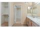 Bathroom with double sinks, walk-in closet, and a tub at 2935 W Kristal Way, Phoenix, AZ 85027