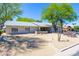 Charming single-story home with desert landscaping, mature trees, and a circular driveway at 2935 W Kristal Way, Phoenix, AZ 85027