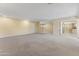 Expansive carpeted living room with recessed lights, neutral paint, and doorway to kitchen at 2935 W Kristal Way, Phoenix, AZ 85027