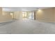 Large carpeted living space with sliding glass doors and natural light at 2935 W Kristal Way, Phoenix, AZ 85027